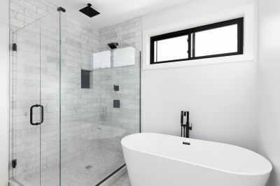 Walk-In Shower Featuring Black Frame Accents